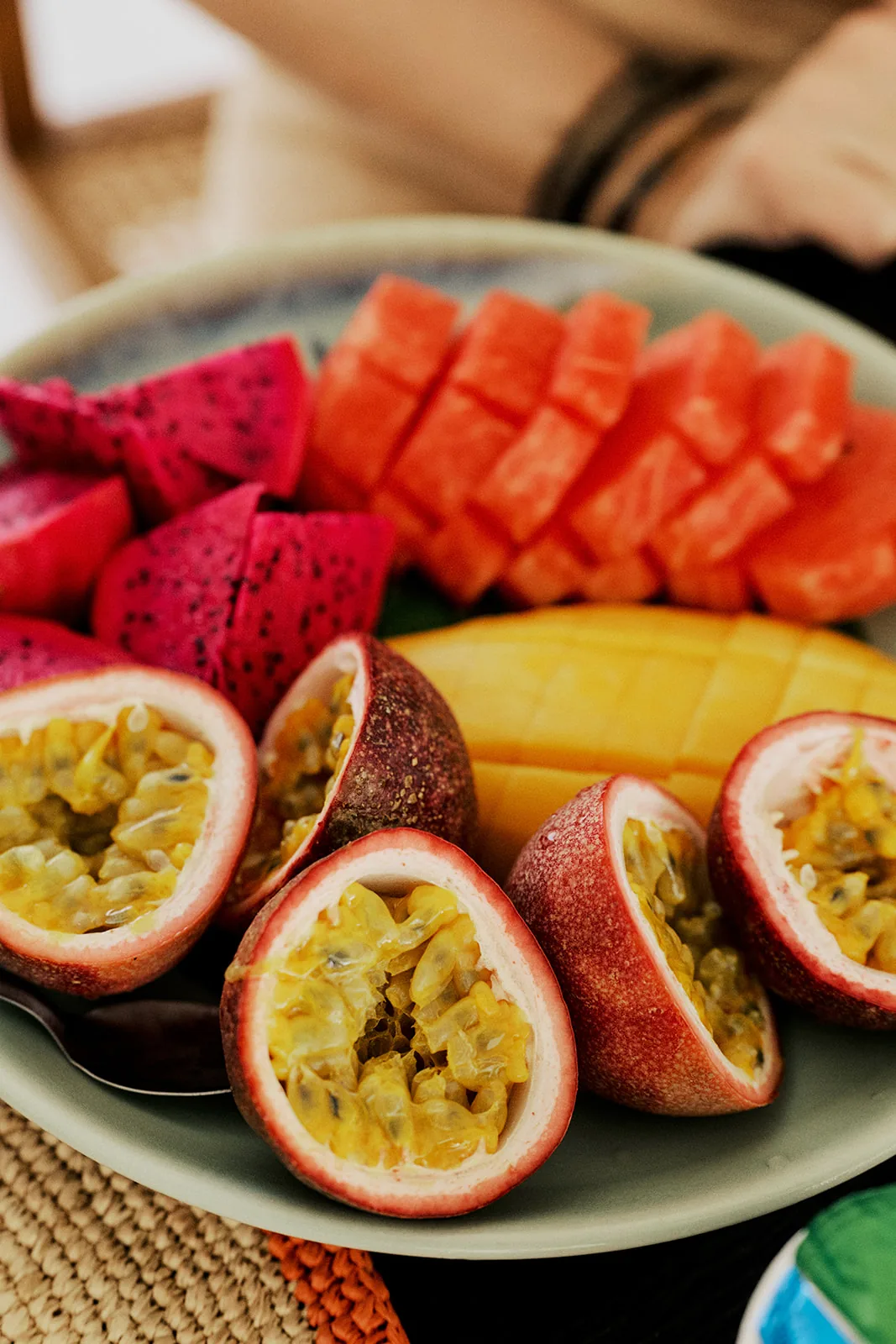 Passion fruit, papaya and mango plated for breakfast