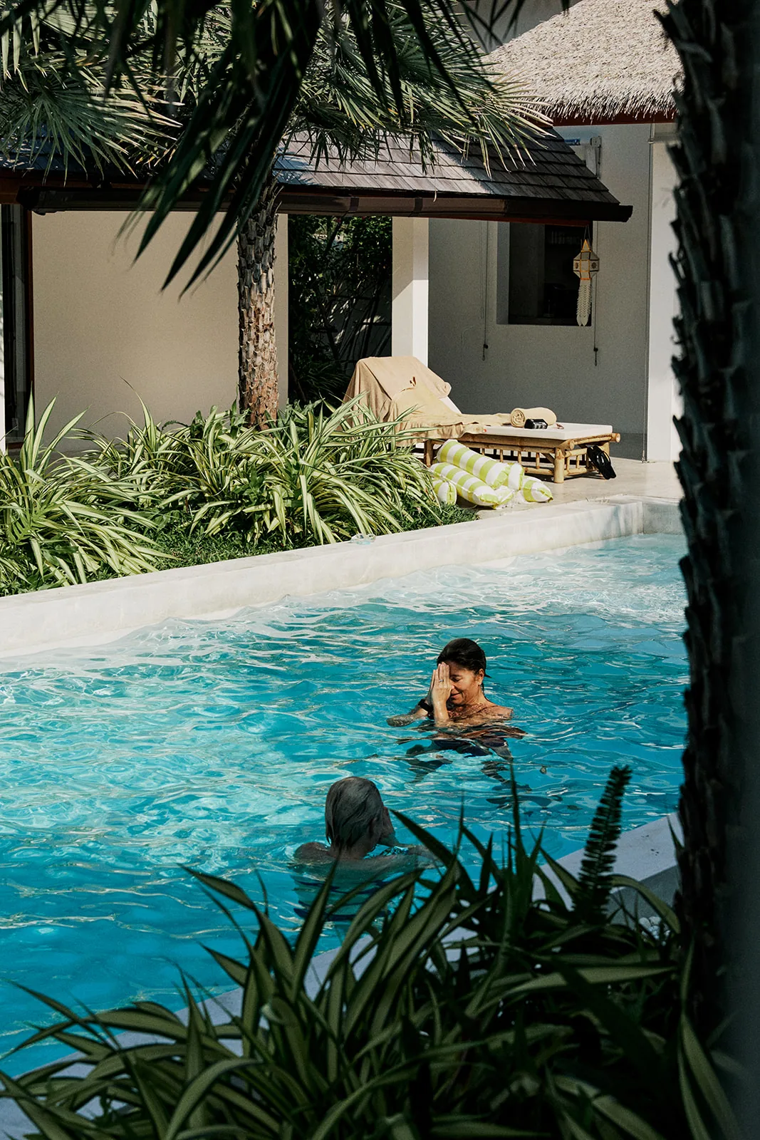 A child splashing in the pool