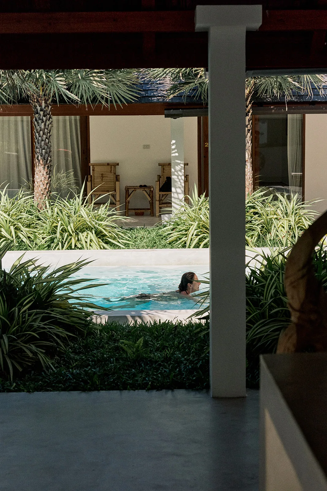 A quiet plunge-pool corner between the pavilions