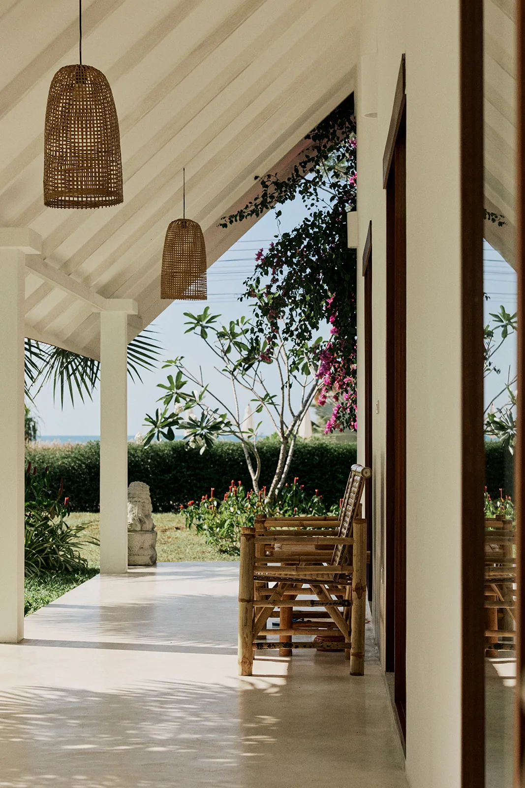 The covered walkway between the pavilions, opening onto the garden