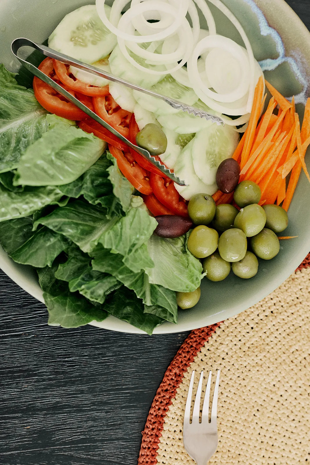 A fresh garden salad with crisp vegetables and grapes