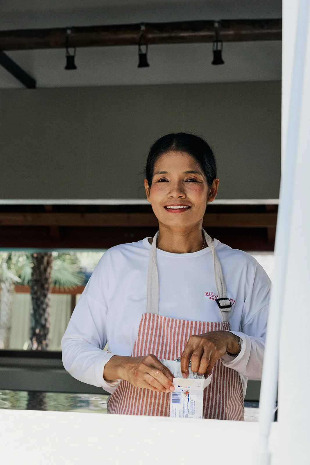 Chef Kae smiling in the kitchen