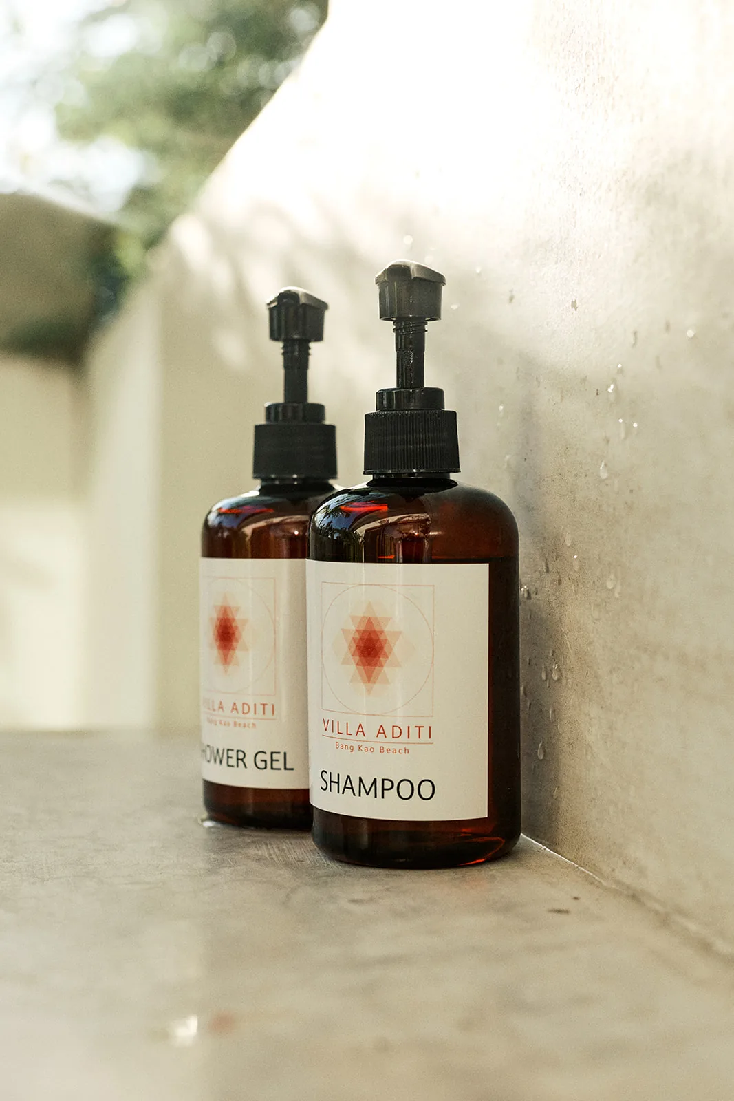 Villa Aditi shower gel and shampoo in a garden bathroom