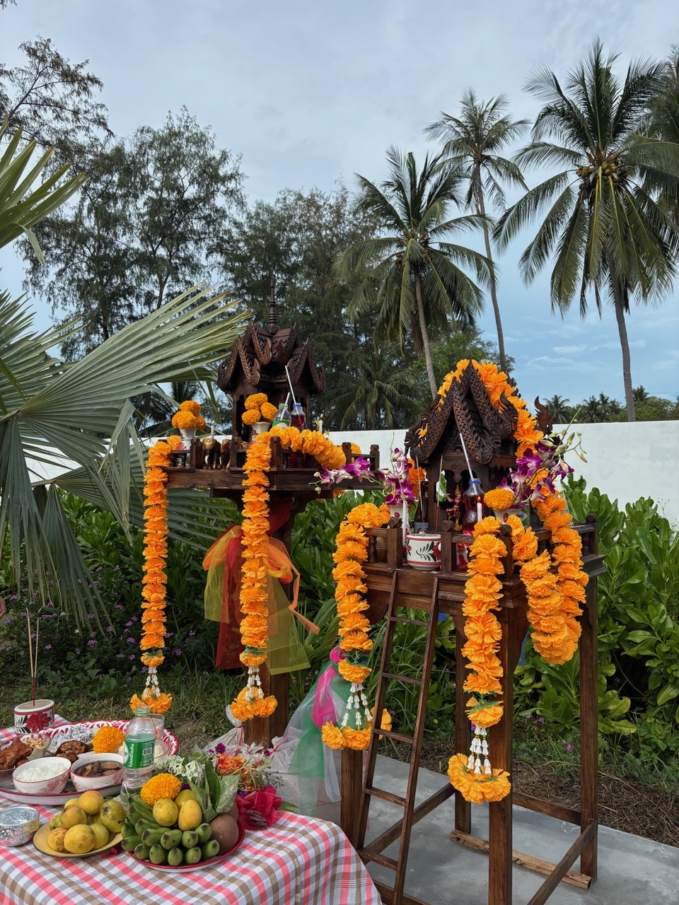 Traditional Thai Spirit House with offerings