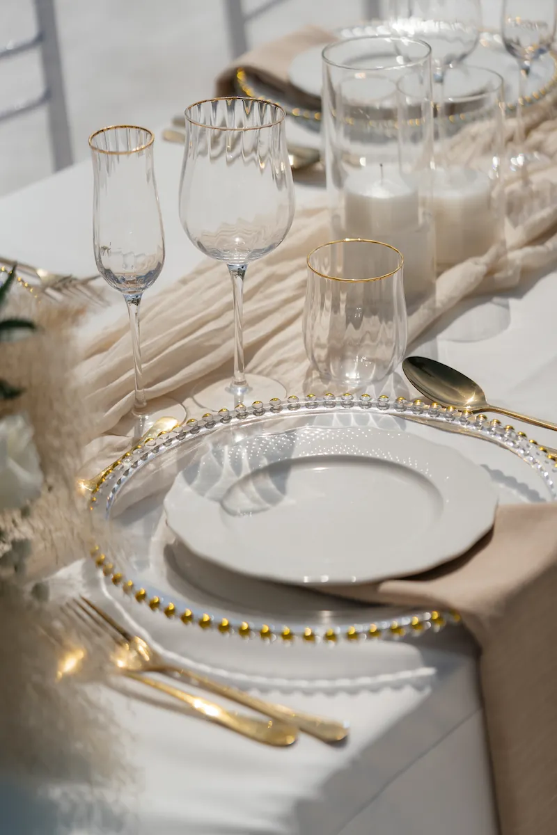 Gold-rimmed dinner place setting detail at Villa Aditi, Koh Samui